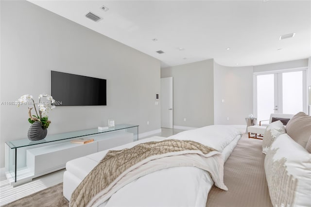 carpeted bedroom featuring french doors