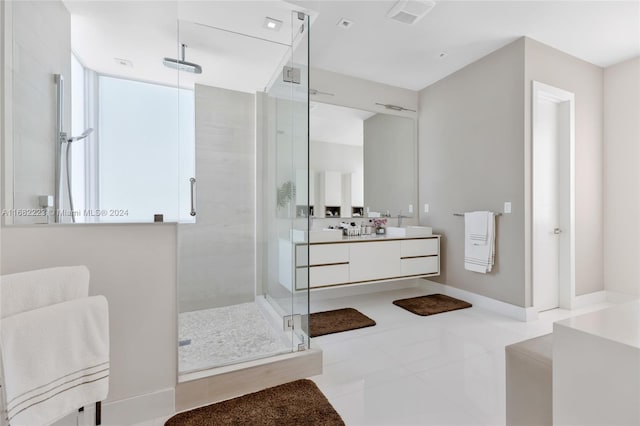 bathroom with vanity, walk in shower, and tile patterned floors