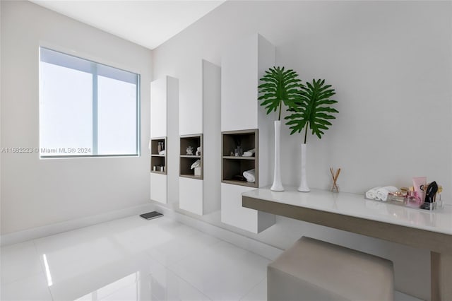 hall featuring light tile patterned flooring