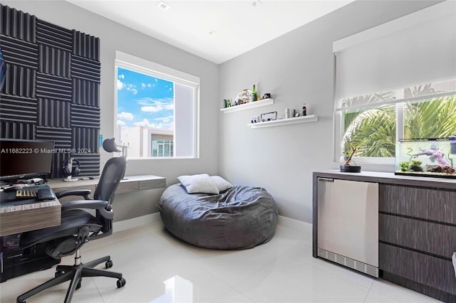 office area with a healthy amount of sunlight and light tile patterned floors