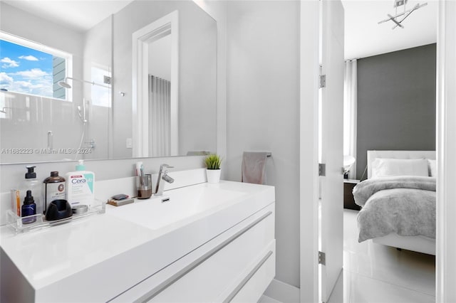 bathroom featuring vanity, tile patterned floors, and a shower with shower door