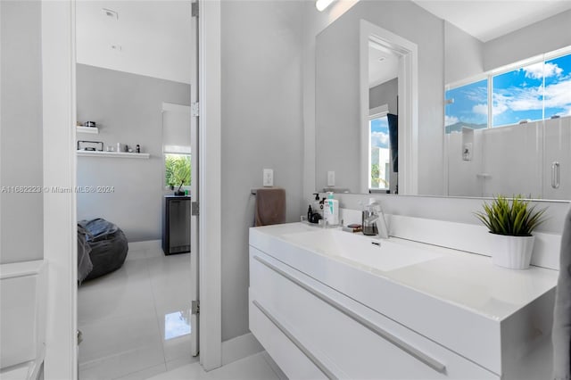 bathroom with vanity and tile patterned flooring