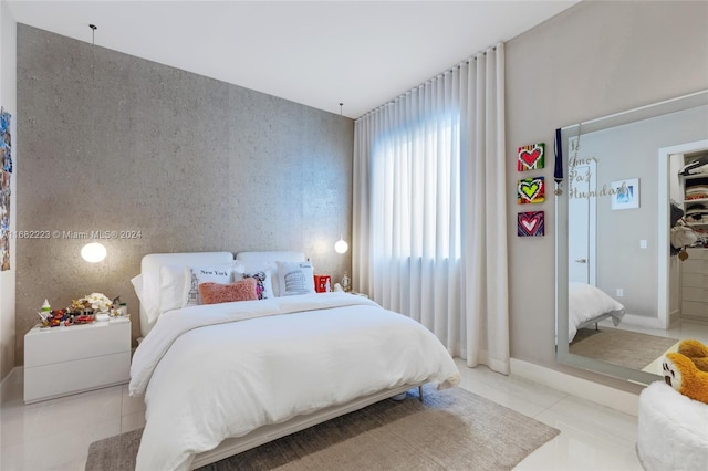 bedroom featuring light tile patterned floors