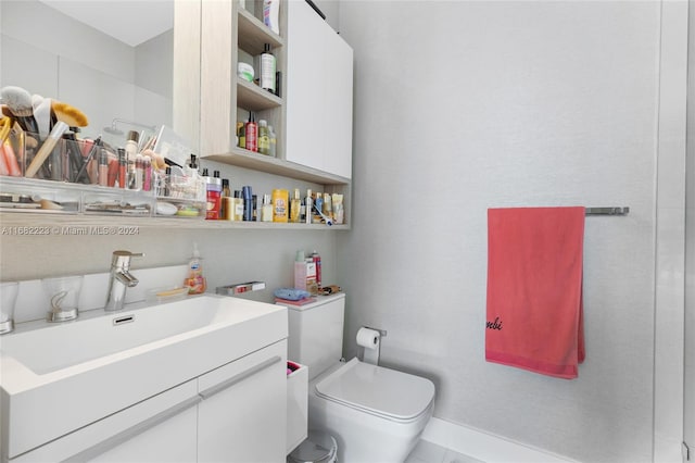 bathroom with toilet and vanity