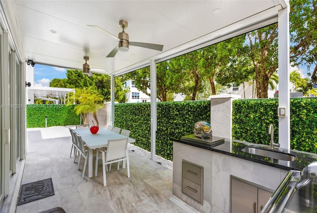 view of patio with sink and ceiling fan