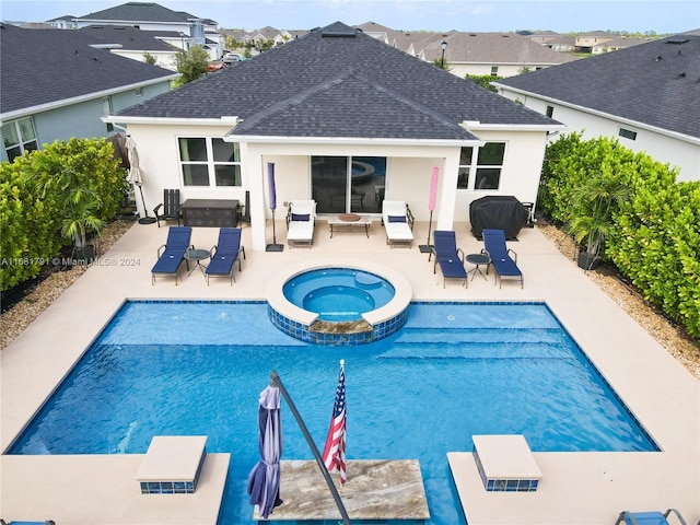 view of swimming pool with grilling area, an outdoor hangout area, a patio, central AC unit, and an in ground hot tub