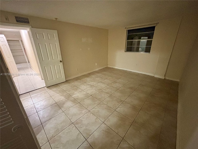 view of tiled spare room