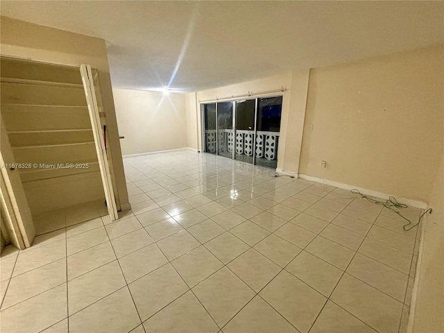 empty room featuring light tile patterned floors