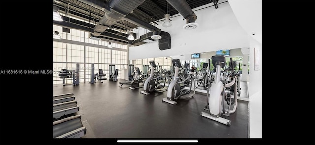 exercise room featuring expansive windows