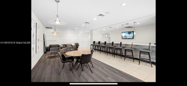 dining room featuring light tile patterned floors, visible vents, and recessed lighting