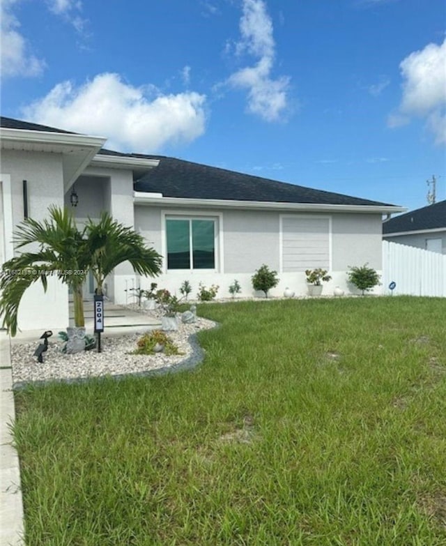 exterior space with a patio and a lawn