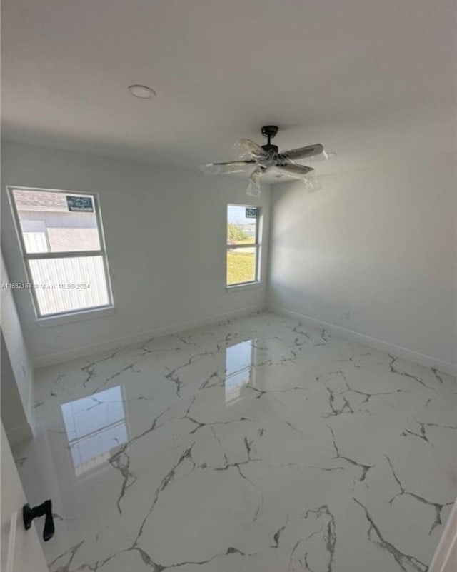 empty room with ceiling fan