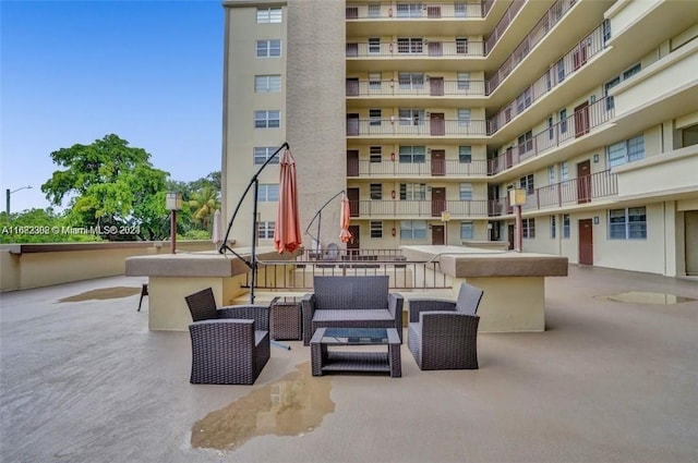 exterior space with a balcony and outdoor lounge area