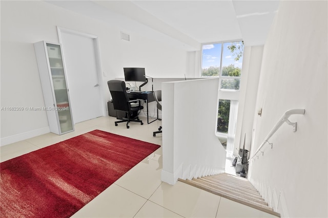 tiled office featuring floor to ceiling windows