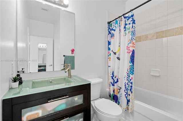 full bathroom featuring shower / bath combo, vanity, and toilet