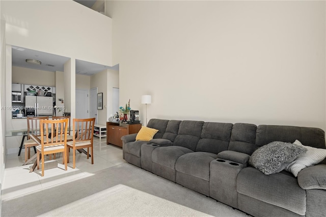 living room featuring a high ceiling