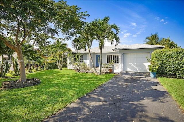 single story home with a front lawn and a garage