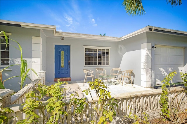 entrance to property featuring a garage