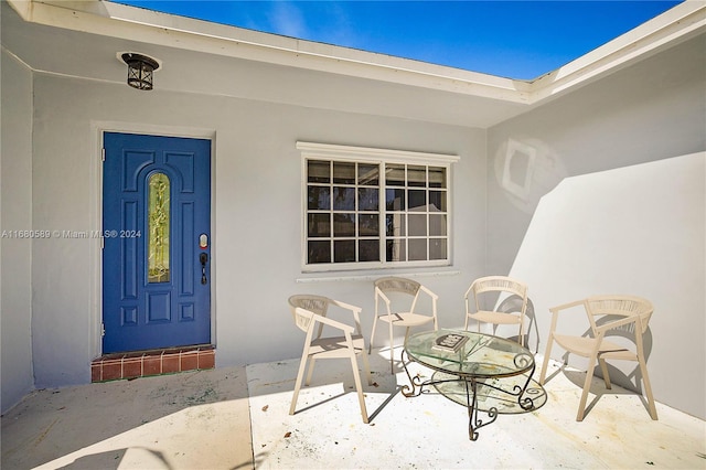 doorway to property featuring a patio area