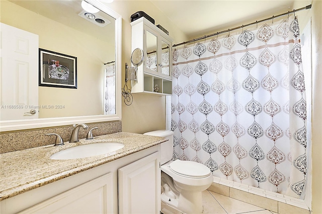 bathroom with vanity, toilet, tile patterned floors, and a shower with curtain