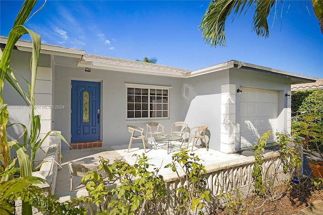 view of exterior entry featuring a garage