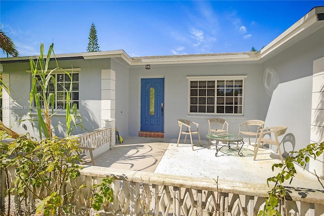 entrance to property with a patio area