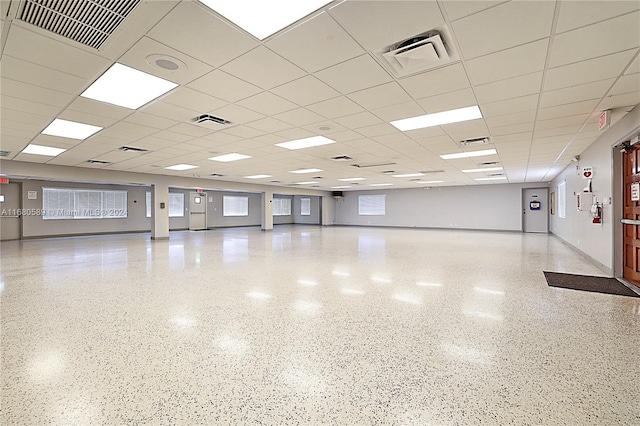 unfurnished room with a paneled ceiling