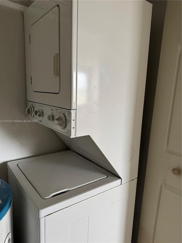 laundry room featuring stacked washer / dryer