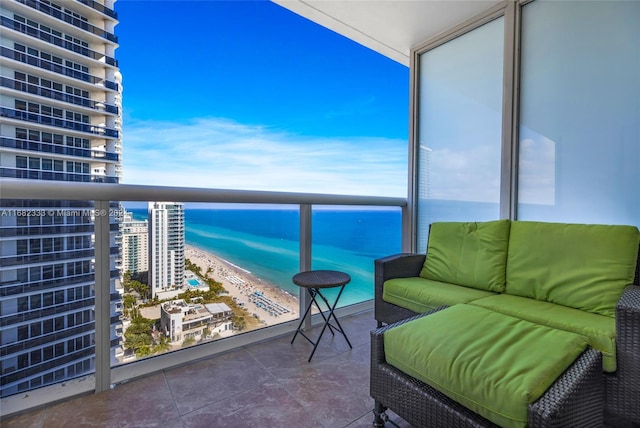 balcony with a view of the beach and a water view