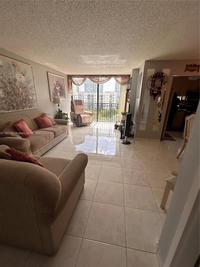 living room with light tile patterned floors and a textured ceiling