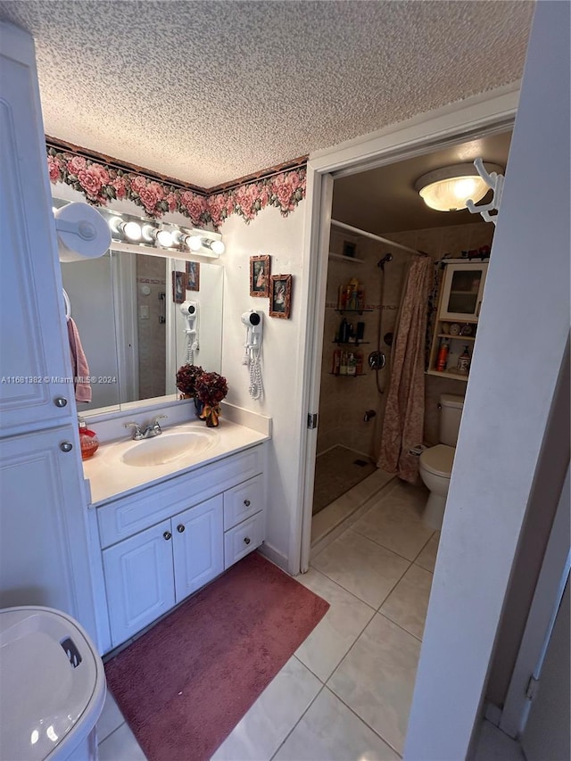 bathroom with tile patterned floors, a shower with curtain, vanity, a textured ceiling, and toilet