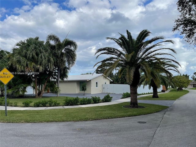 view of property exterior with a yard