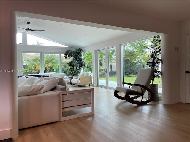 sunroom with ceiling fan and lofted ceiling