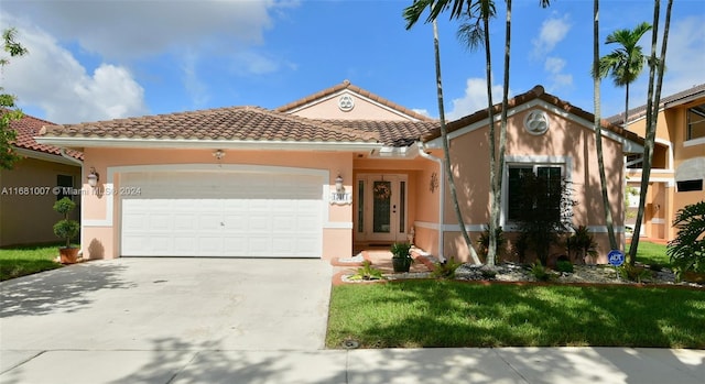 mediterranean / spanish-style home with a garage