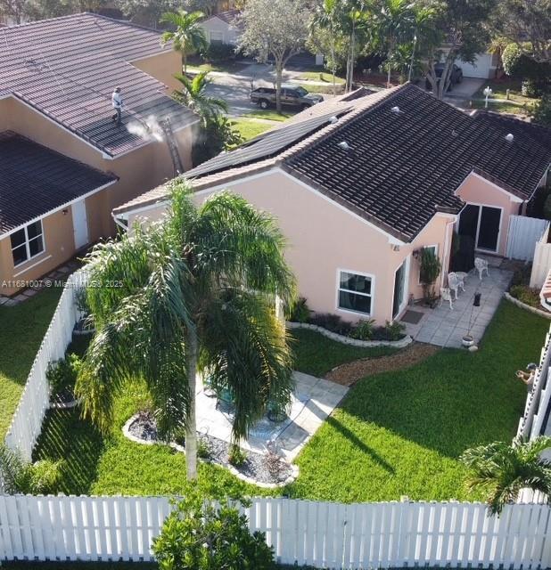 view of property exterior featuring a lawn and a garage