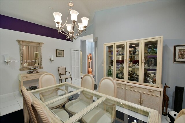 tiled dining space with an inviting chandelier