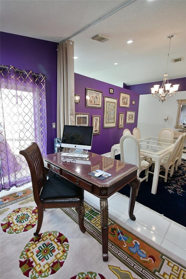 carpeted home office featuring an inviting chandelier