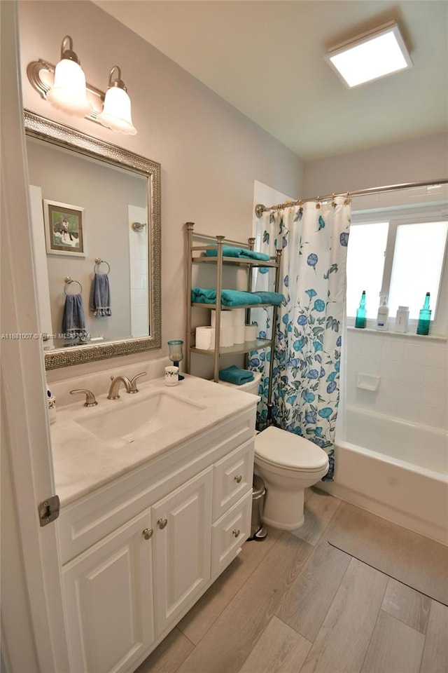 full bathroom featuring vanity, toilet, shower / tub combo with curtain, and hardwood / wood-style floors