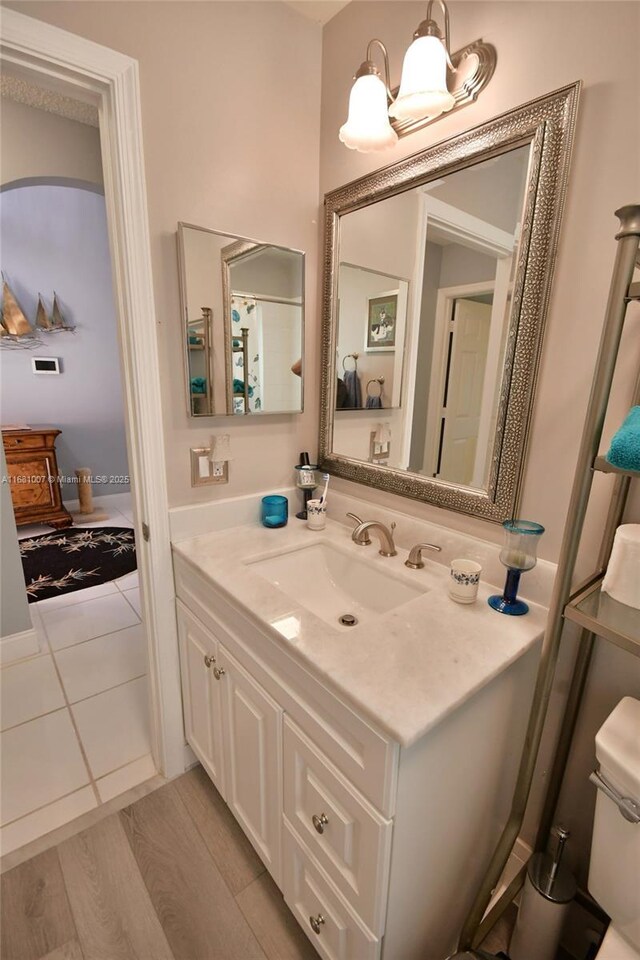 bathroom featuring vanity and hardwood / wood-style floors