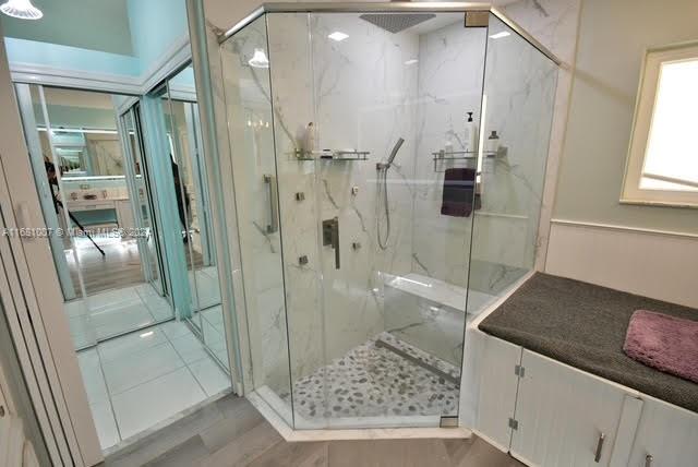 bathroom featuring an enclosed shower