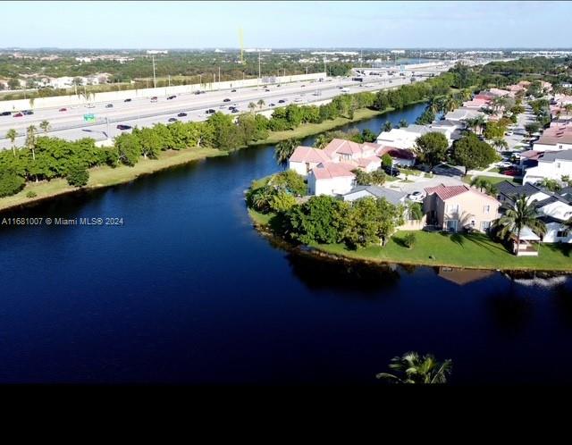 bird's eye view with a water view