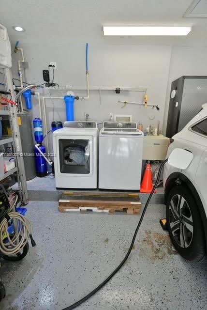 laundry area with separate washer and dryer