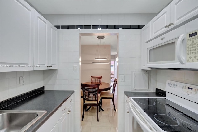 kitchen with white cabinetry, white appliances, and pendant lighting