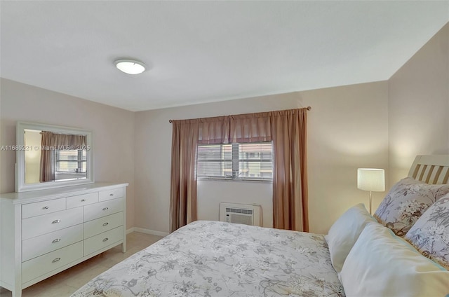 bedroom featuring a wall unit AC