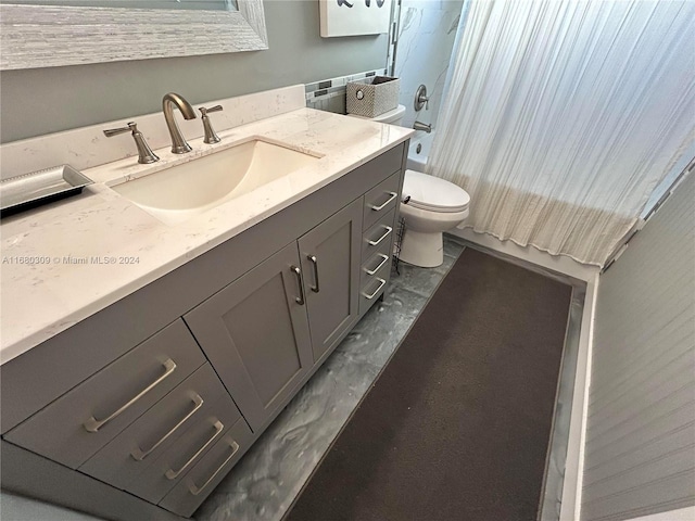 bathroom with vanity and toilet