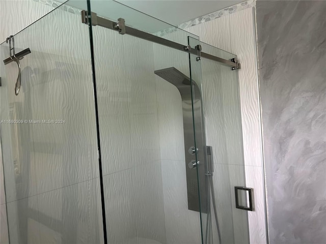 interior details featuring an enclosed shower