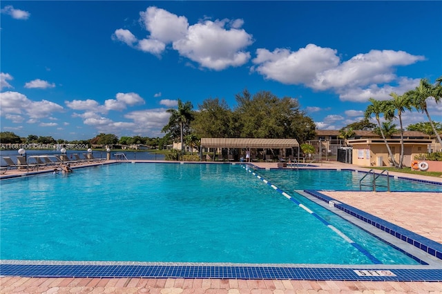 view of swimming pool with a patio