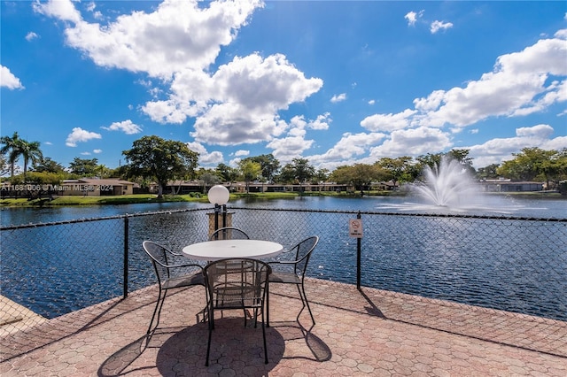 view of patio with a water view