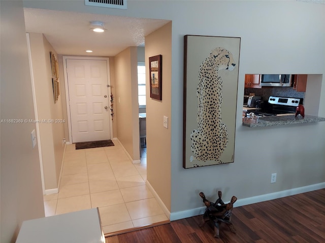 hallway with light wood-type flooring