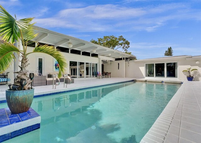 view of swimming pool featuring a patio area